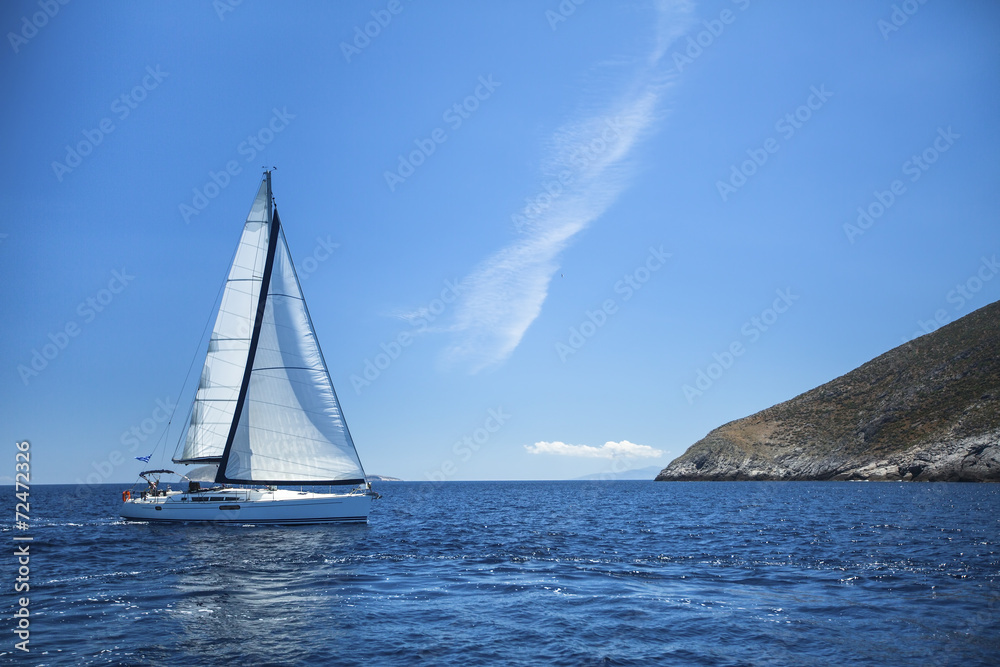 Sailboat in the calm sea. Sailing. Luxury yachts. Sailboat in the calm sea. Sailing. Luxury yachts.