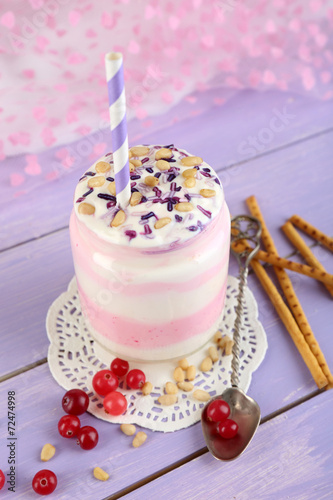 Cranberry milk dessert in glass jar,