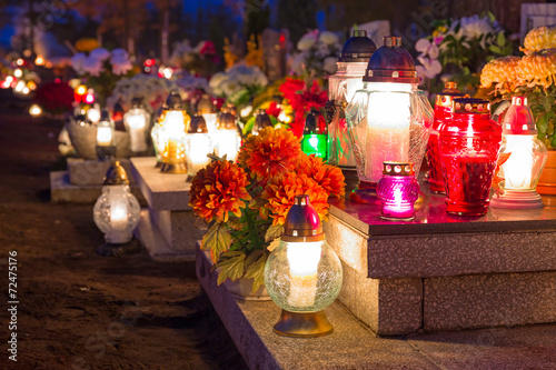 Colorful candles on the cemetery at All Saints Day, Poland