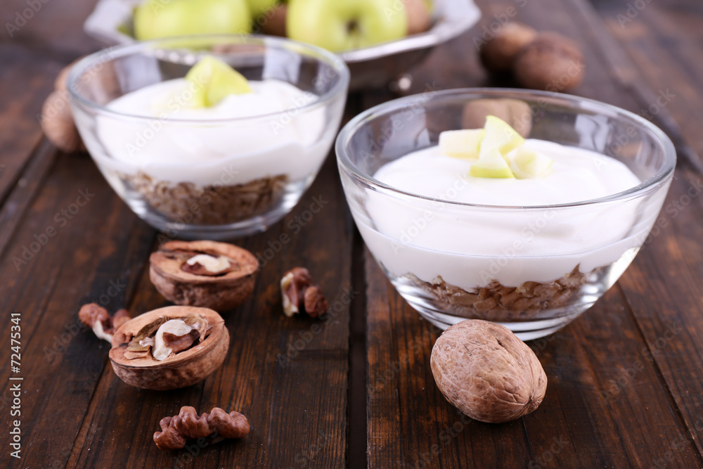 Oatmeal with yogurt in bowls, apples and walnuts Oatmeal with yogurt in bowls, apples and walnuts