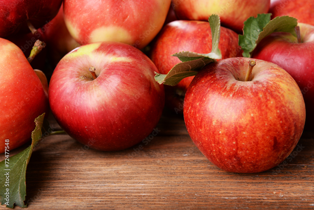 Ripe red apples on wooden background Ripe red apples on wooden background