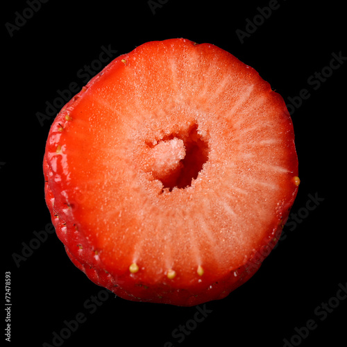 Strawberry slice on black background