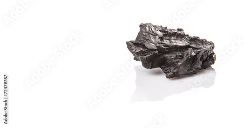 Lump of charcoal over white background