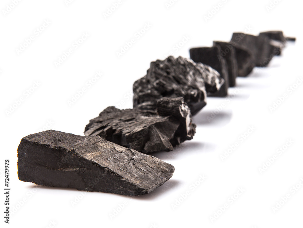 Lump of charcoal over white background Lump of charcoal over white background