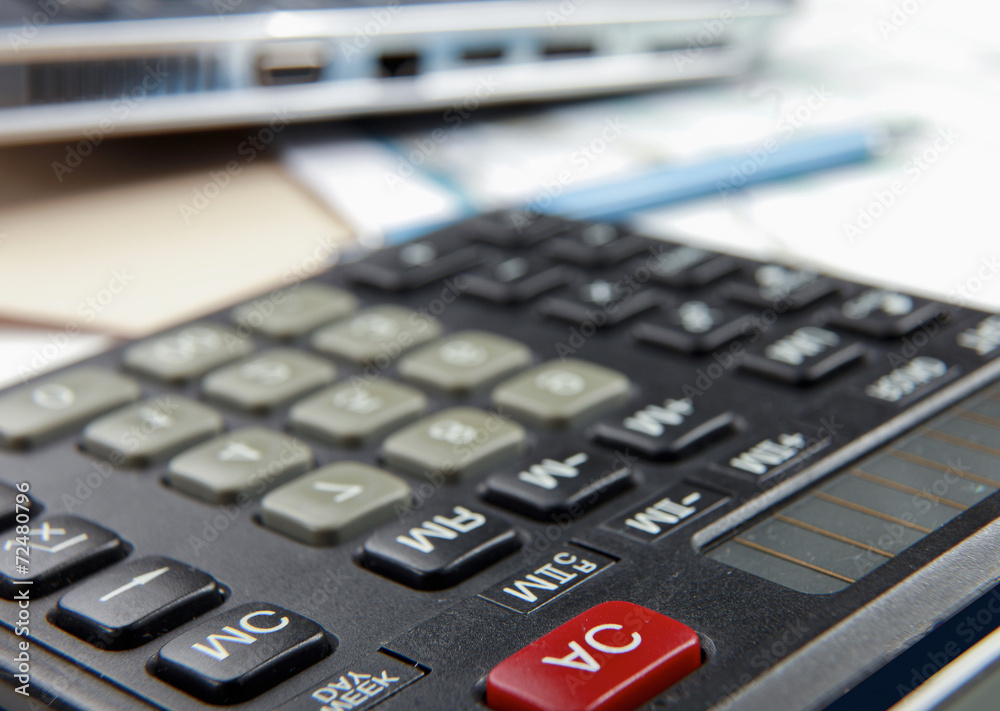 Calculator, pen, folder with documents, laptop Calculator, pen, folder with documents, laptop