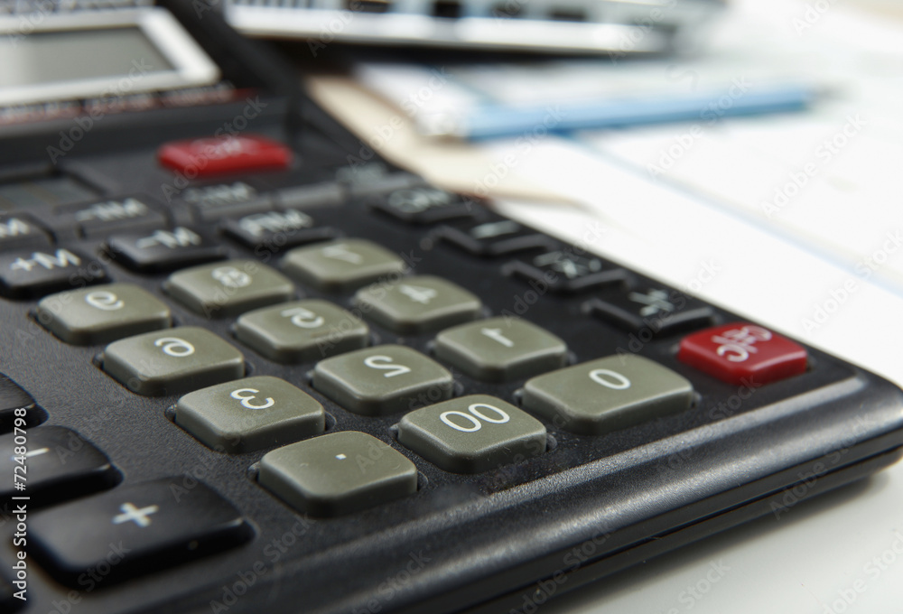 Calculator, pen, folder with documents, laptop Calculator, pen, folder with documents, laptop