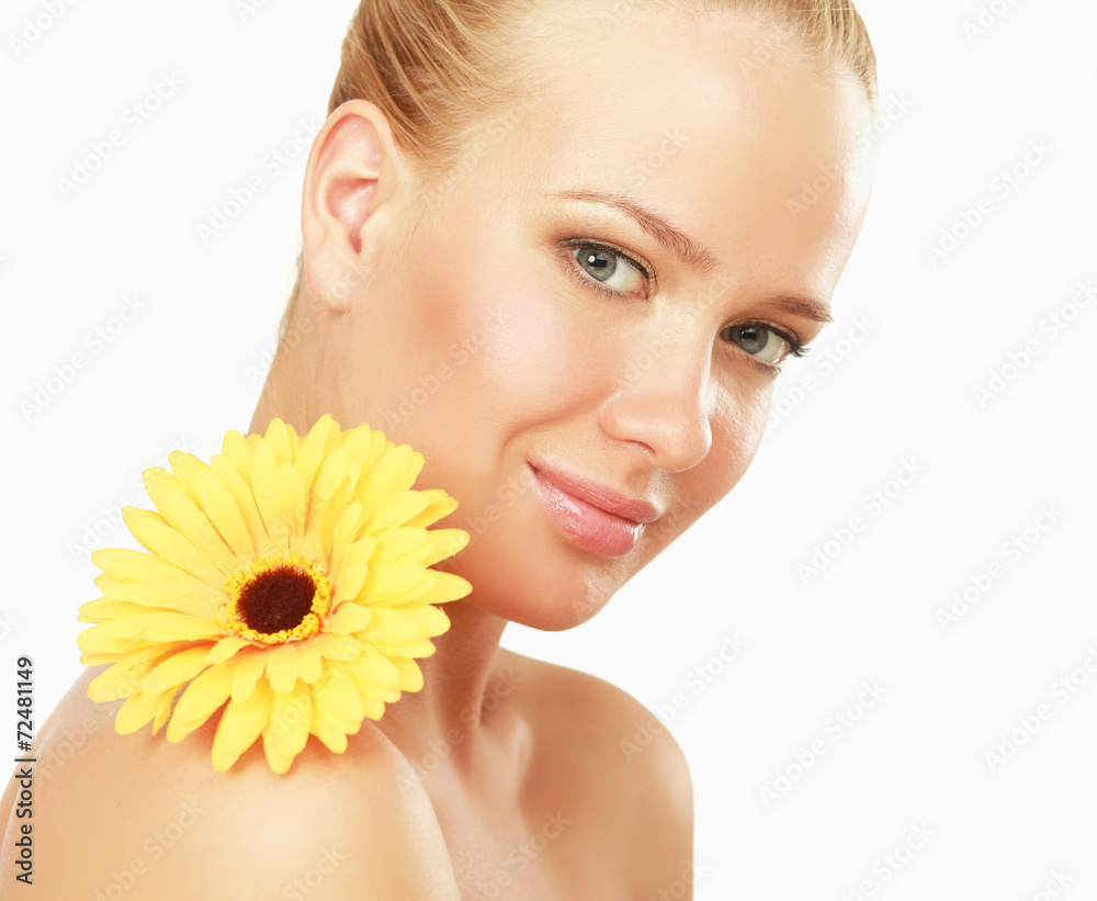 A young woman with a yellow flower, isolated on white A young woman with a yellow flower, isolated on white