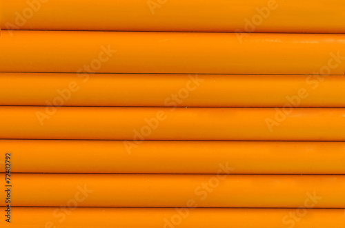 Orange plastic tubing pattern texture background