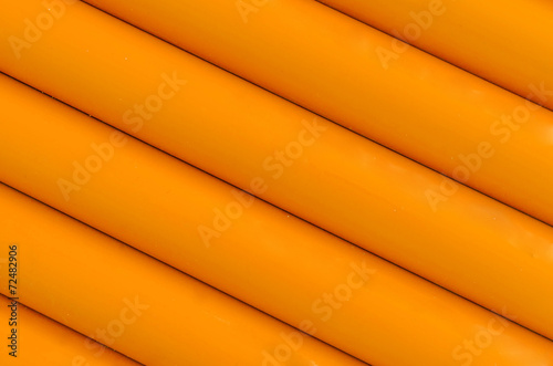 Orange plastic tubing pattern texture background