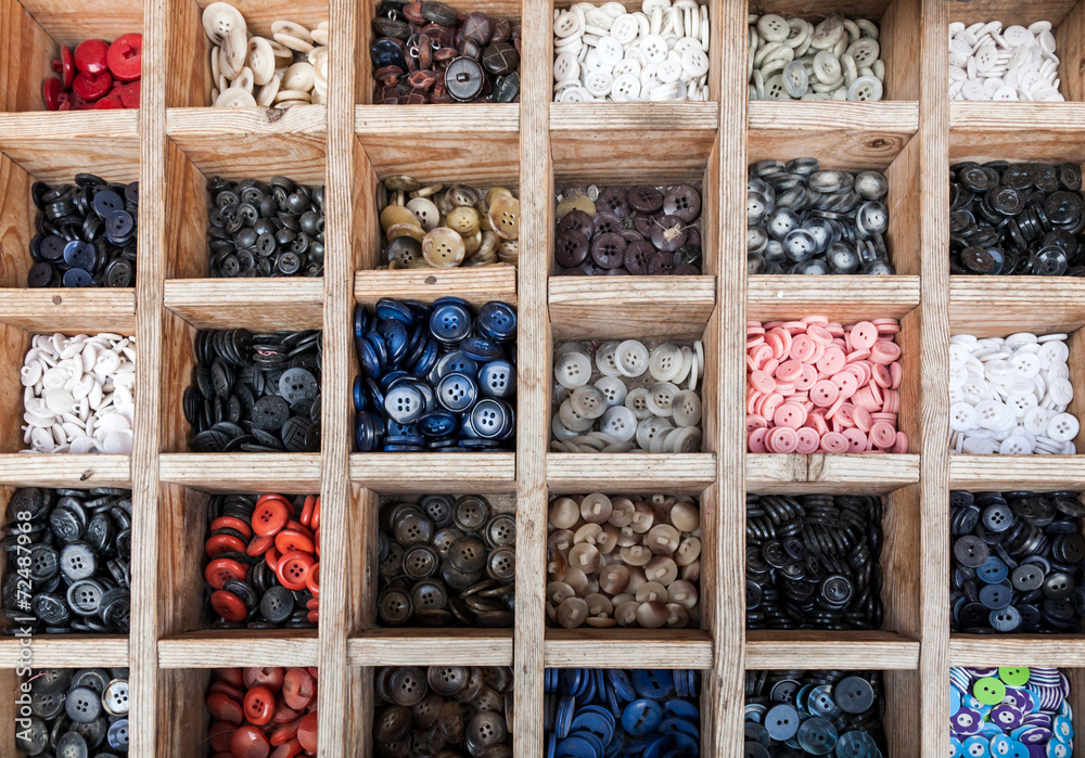 Coloured buttons in wooden box
