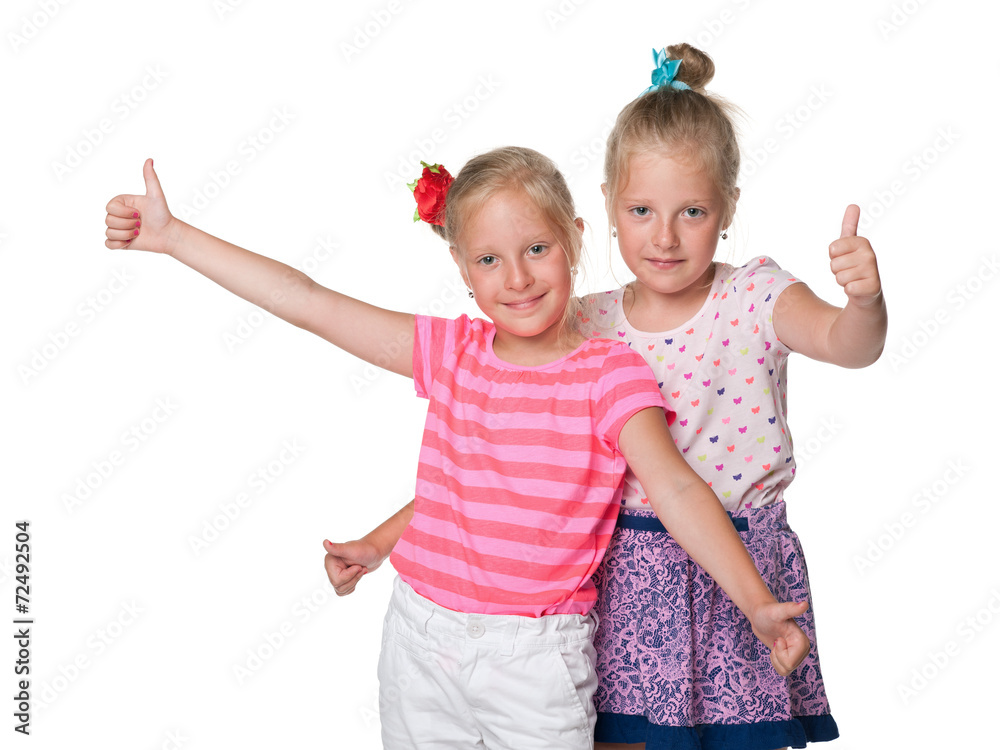 Cheerful girls hold their thumbs up Cheerful girls hold their thumbs up