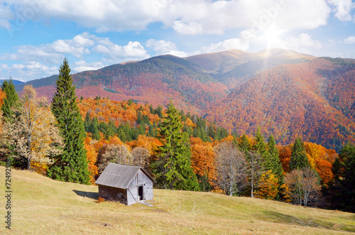 Hut in a mountain forest. Autumn Landscape