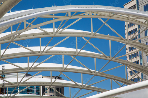 White Curved Tubular Steel Architecture Under Blue Sky © dbvirago