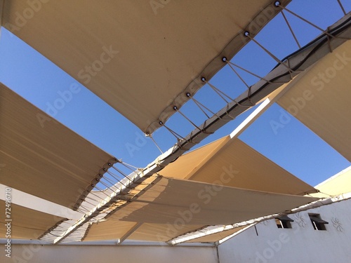 Wallpaper Mural White awnings and blue sky background Torontodigital.ca
