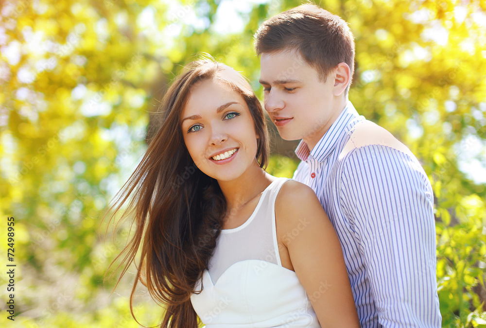 Pretty young couple in love outdoors in sunny summer day Pretty young couple in love outdoors in sunny summer day