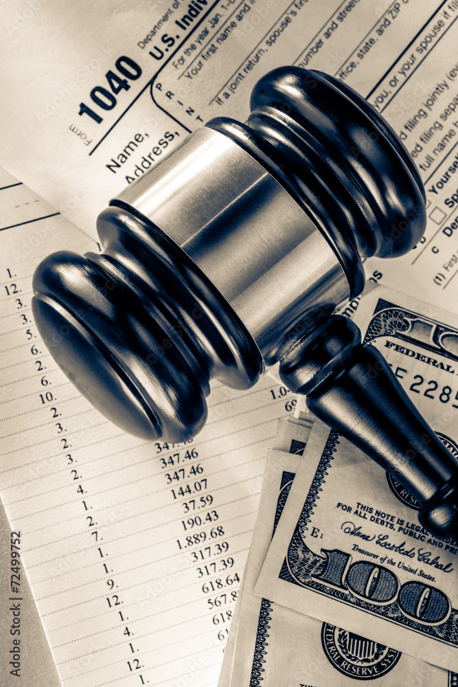 Budget, tax form, gavel and dollars