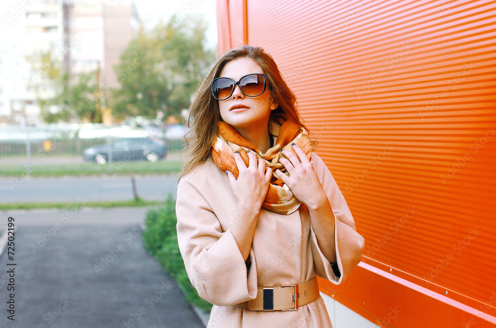 Fototapeta premium Pretty sensual woman in coat posing in the city, street fashion