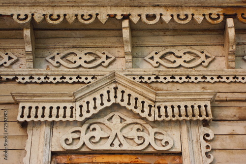 Traditional wooden Russian carved platband of an old house