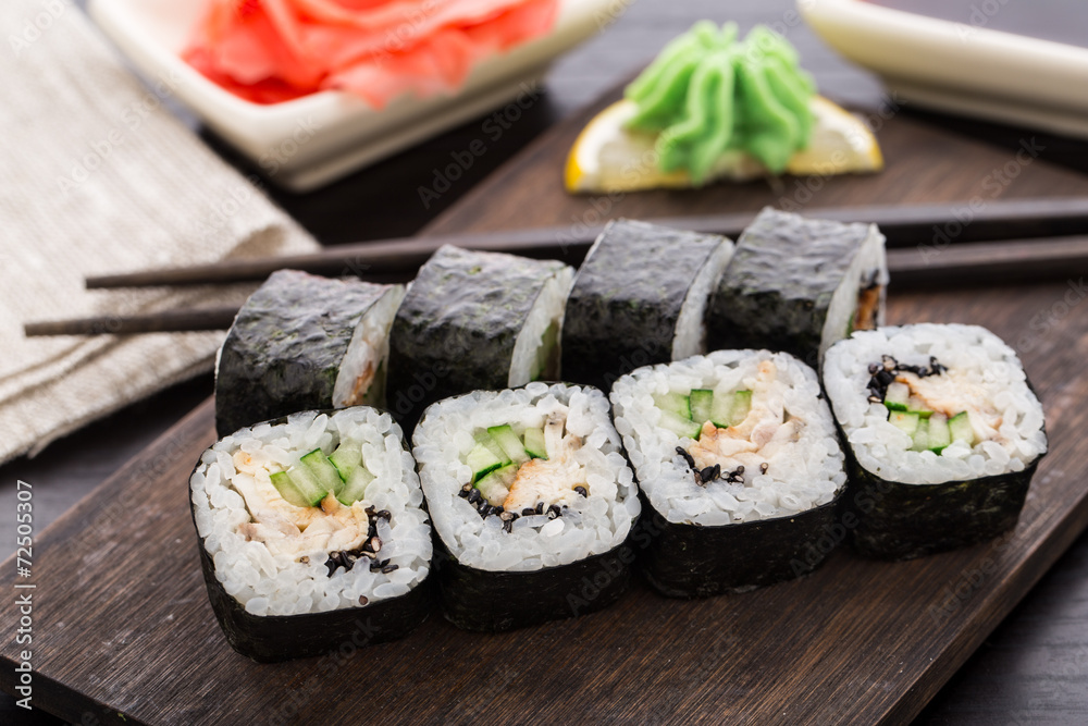 Sushi rolls with eel, cucumber and sesame seed Sushi rolls with eel, cucumber and sesame seed