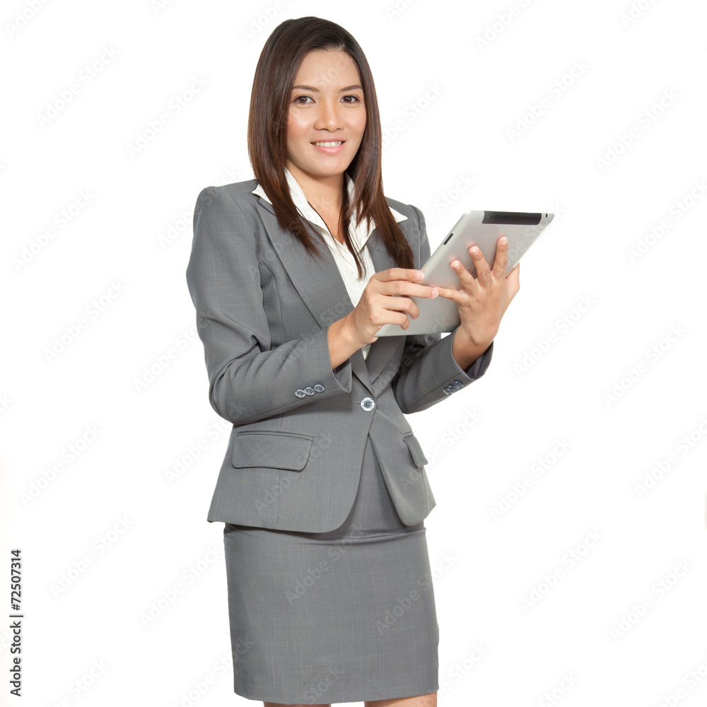 Young pretty Asian business woman gesture using a tablet smiling Young pretty Asian business woman gesture using a tablet smiling
