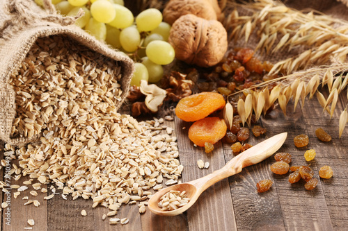 oatmeal in a sac, ears of oats, dried apricots, raisins, grapes,