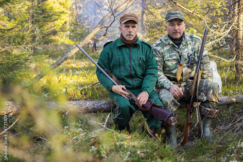 Two older hunters rest