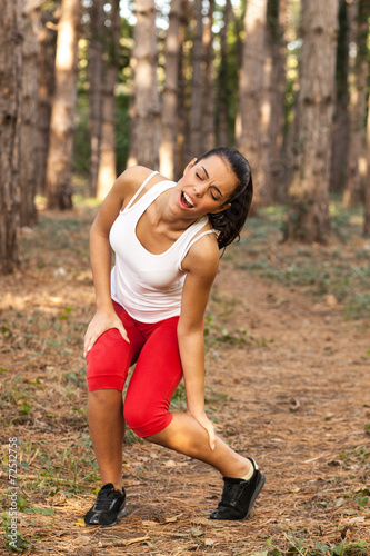 Young woman after running had injuries