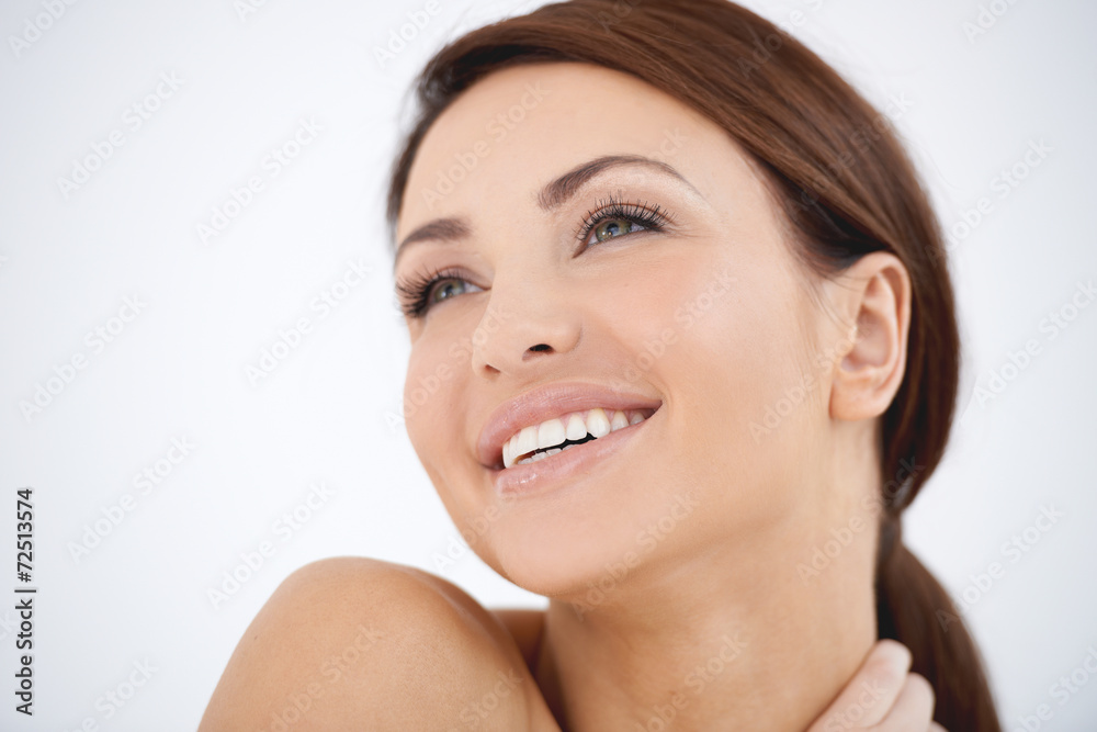 Young woman with a dreamy happy expression Young woman with a dreamy happy expression