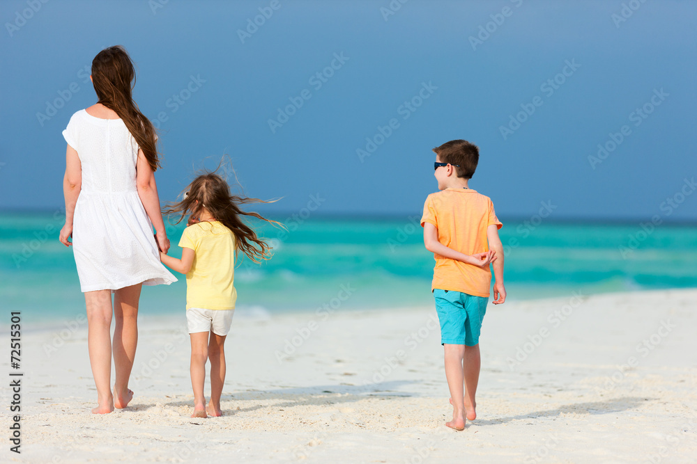 Mother and kids on a tropical beach