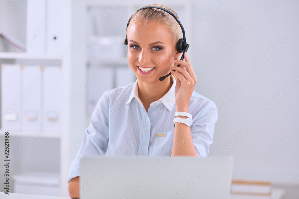 Portrait of beautiful businesswoman working at her desk with Portrait of beautiful businesswoman working at her desk with