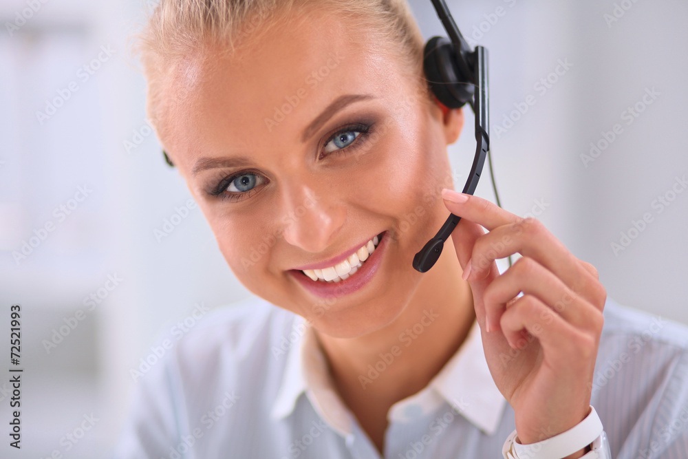 Close-up portrait of a customer service agent sitting at office Close-up portrait of a customer service agent sitting at office