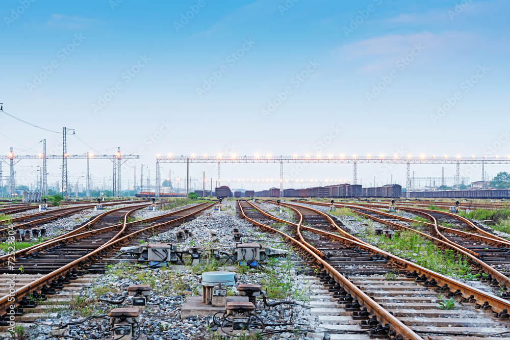 Cargo train platform at sunset with container