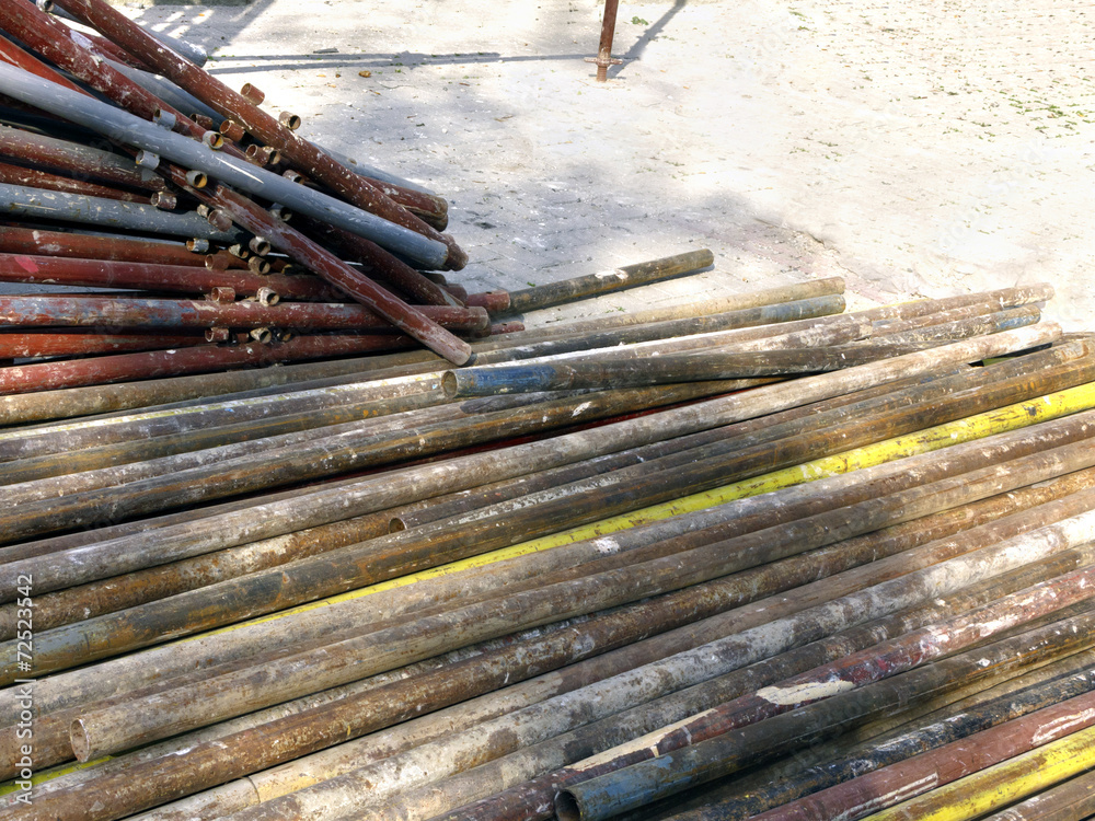 Rusty old pipes for building scaffold Rusty old pipes for building scaffold