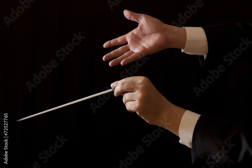 Music male director holding stick