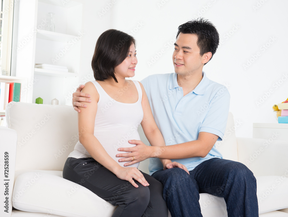 Asian couple. Husband and 8 months pregnant wife. Asian couple. Husband and 8 months pregnant wife.