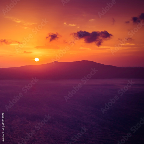 Famous sunset view over sea in Santorini Island  Greece