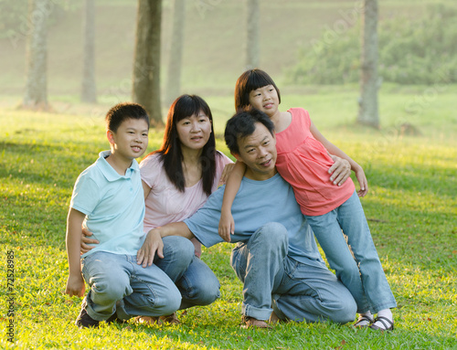 asian family enjoying outdoor at the park