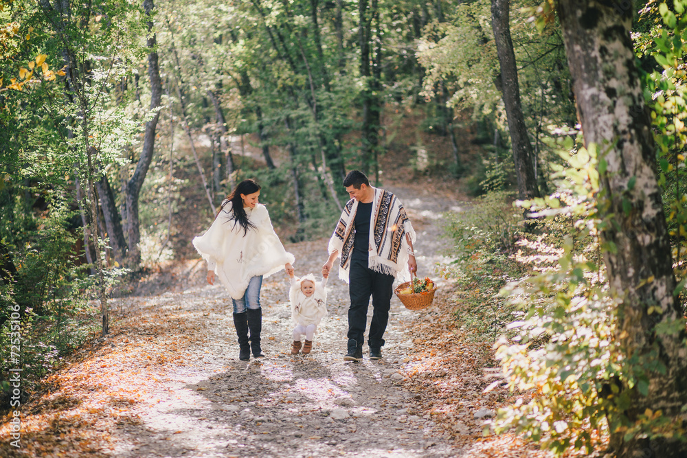Fototapeta premium Happy family in an autumn forest