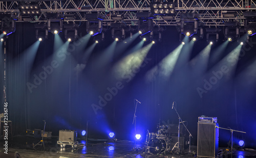 Spotlights and illumination on stage with sound equipment