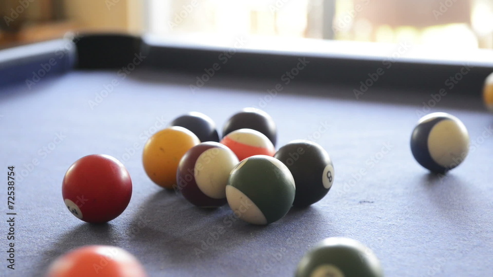 Footage of billiard balls break on a pool table