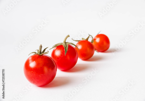 Cherry tomatoes isolated on white background