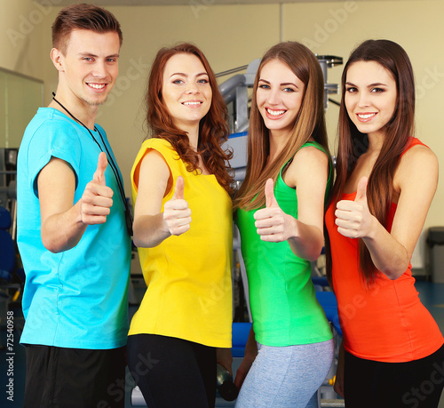 Young beautiful peoples in gym