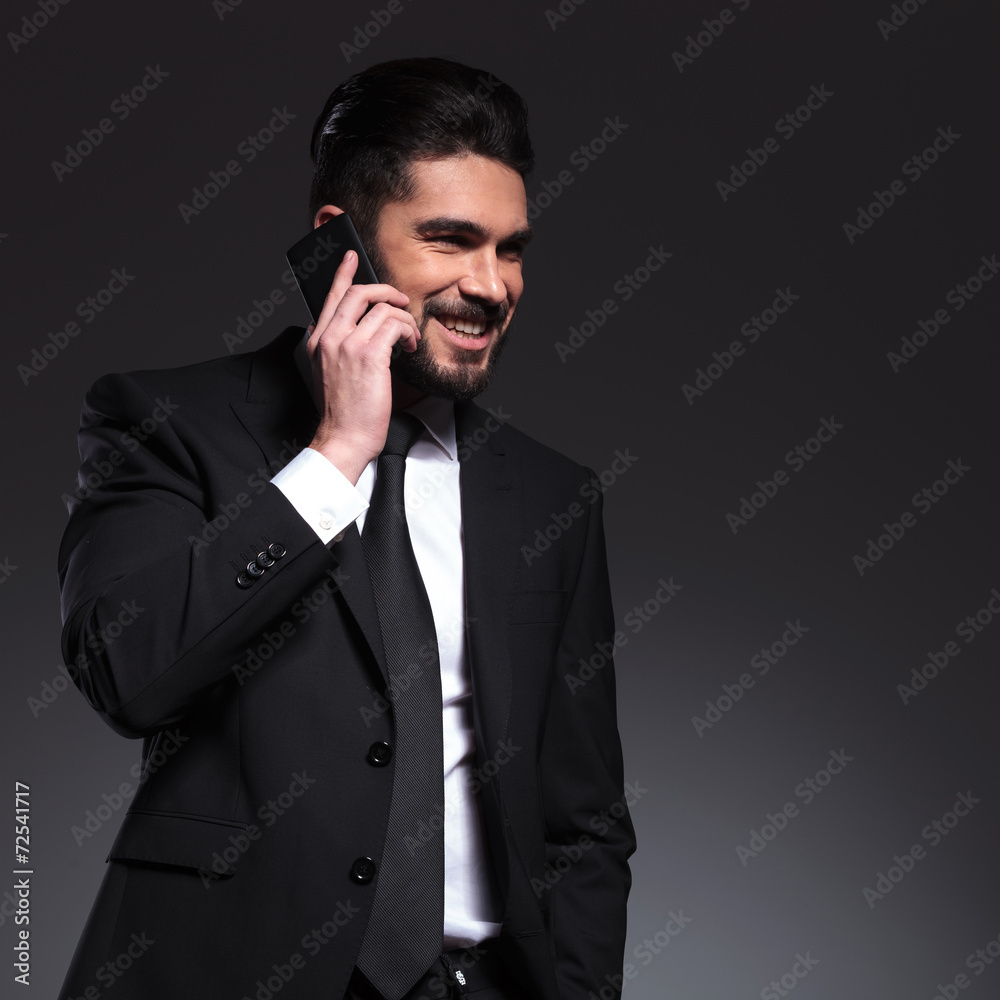 Happy business man talking on the phone, smiling Happy business man talking on the phone, smiling