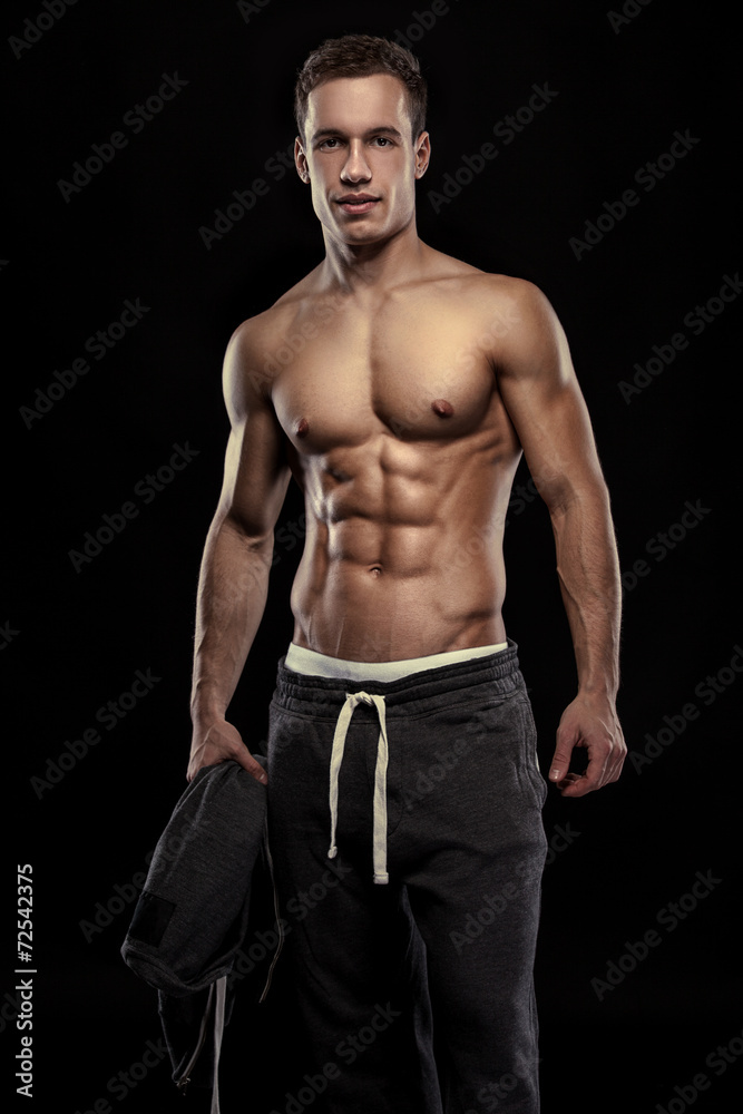 Fototapeta premium Strong Athletic Man Fitness Model Torso showing muscular body