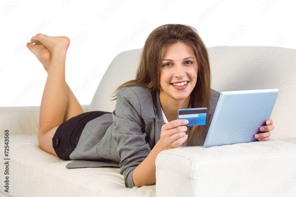 Woman doing online shopping with tablet and credit card Woman doing online shopping with tablet and credit card