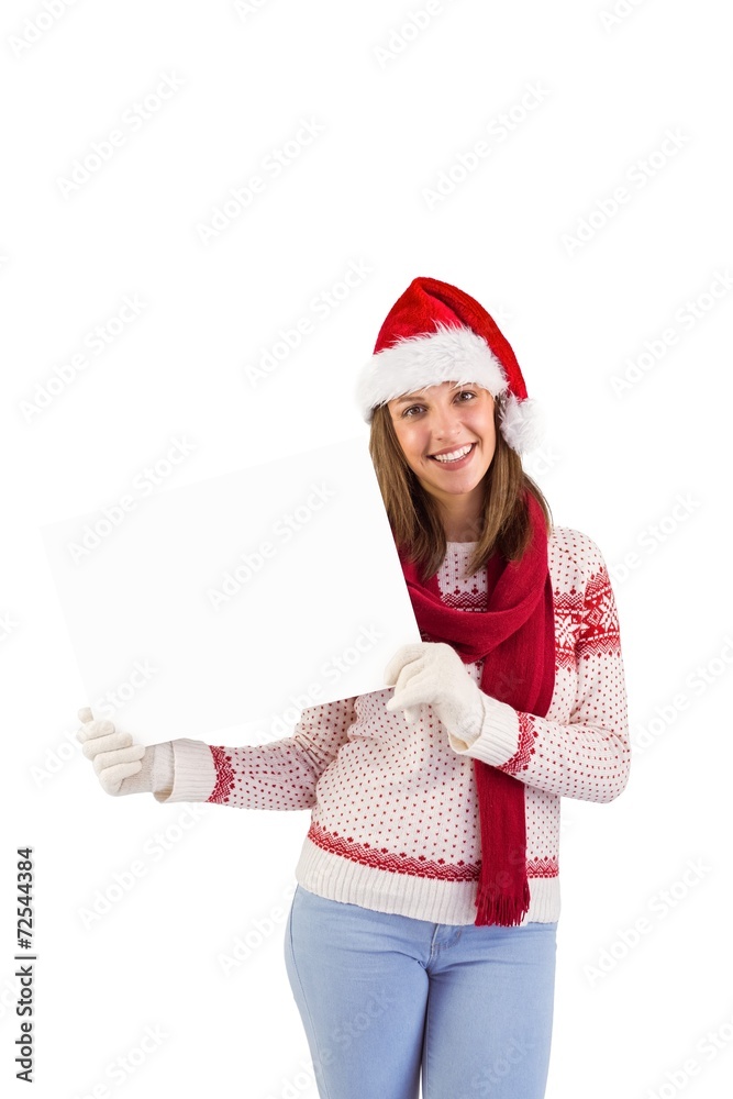Happy brunette in winter clothes showing card Happy brunette in winter clothes showing card
