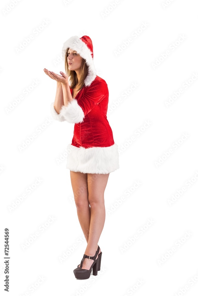 Festive brunette blowing over hands Festive brunette blowing over hands