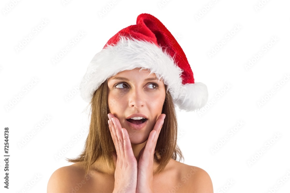Festive brunette looking surprised with hands on face Festive brunette looking surprised with hands on face