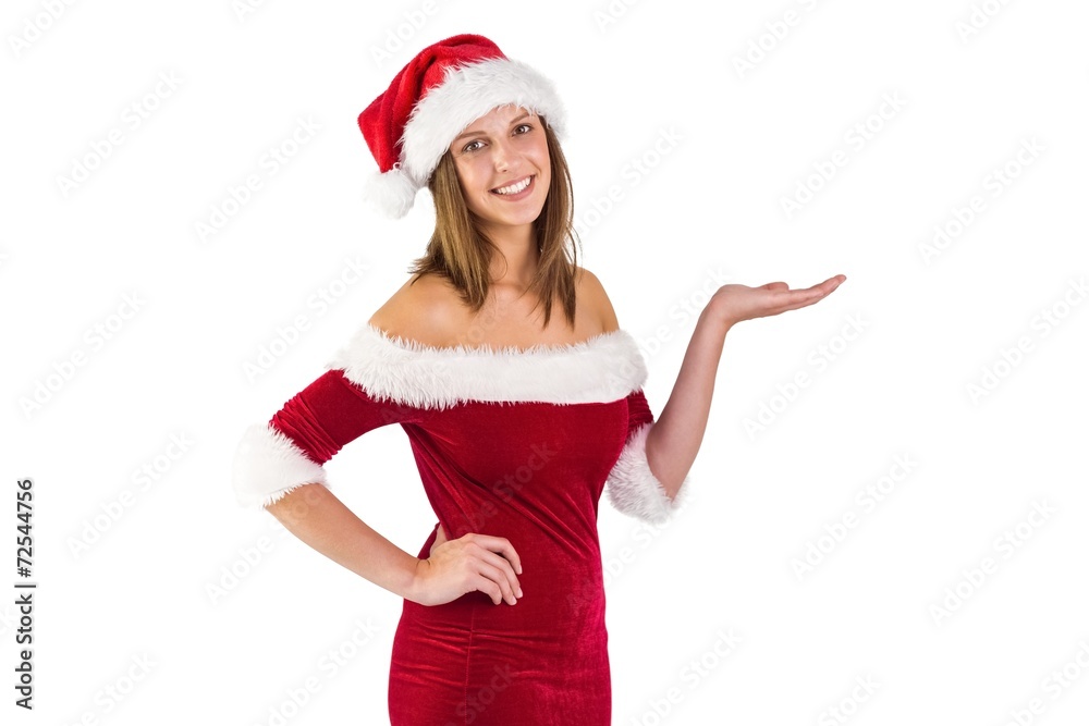 Pretty santa girl smiling at camera and presenting Pretty santa girl smiling at camera and presenting
