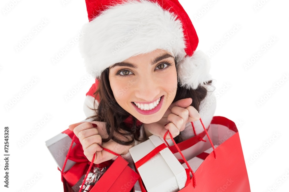 Happy brunette holding shopping bags full of gifts Happy brunette holding shopping bags full of gifts